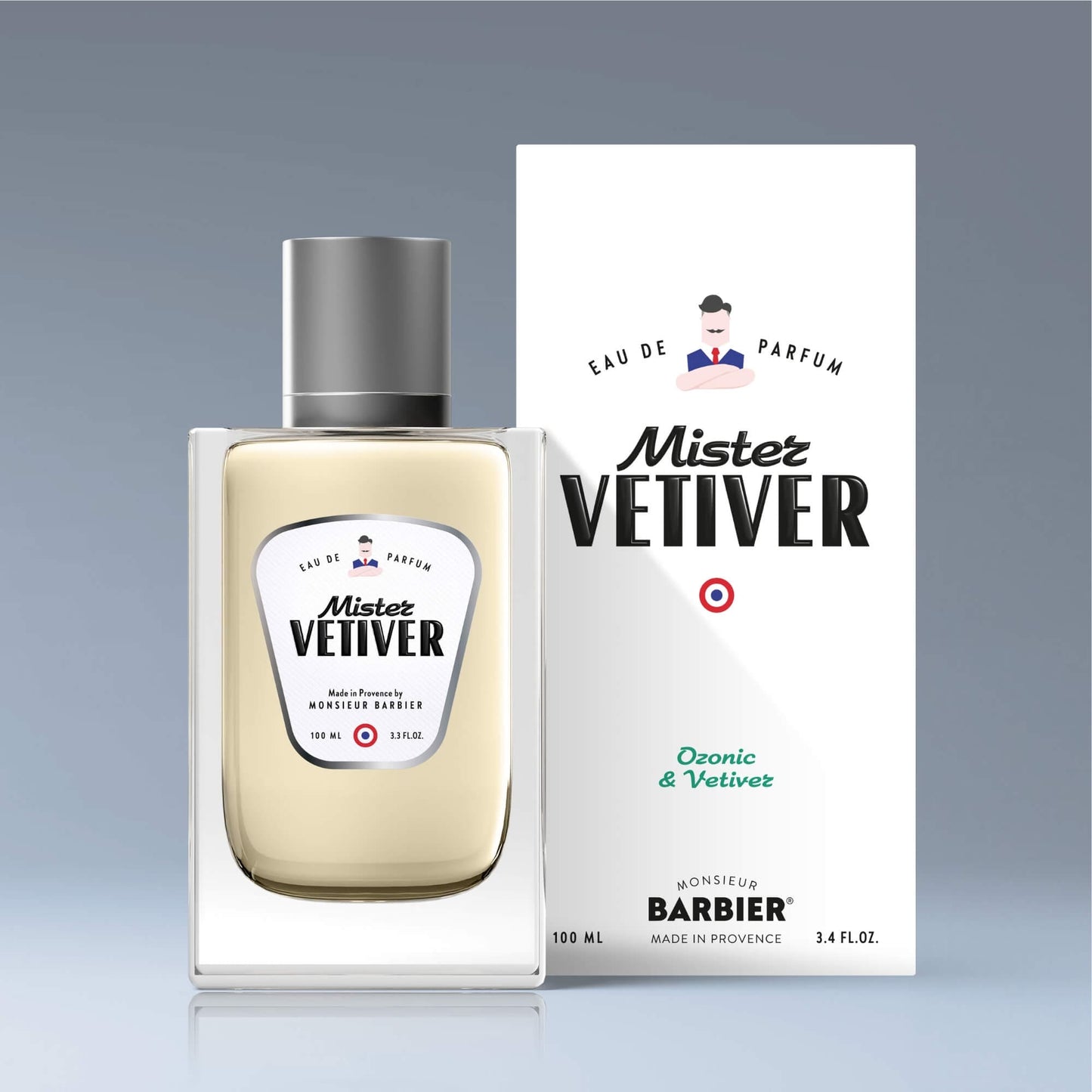 Flacon de parfum Monsieur BARBIER MISTER VETIVER 100 ml devant sa boîte, design élégant avec étiquette rétro, notes ozoniques et vétiver, fond dégradé bleu.