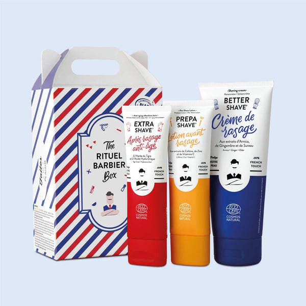 Monsieur BARBIER 的 RITUAL BARBIER BOX 剃须套装，盒子上有一张男性脸部的风格化插图，带有蓝白条纹和红色点缀。