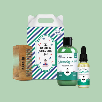 Ensemble de soins pour homme Monsieur BARBIER présenté de face, incluant shampoing, huile sèche et peigne en bois dans un emballage écologique avec poignée, sur fond vert.